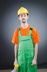 Construction worker with loudspeaker in studio