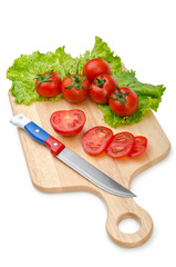 Tomatoes and cucumbers on white