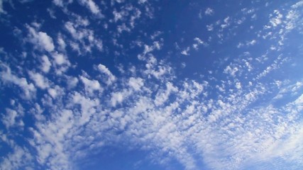 Accelerated blue fluffy cloudscape