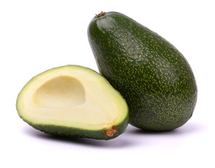 Ripe cut avocado isolated on white background