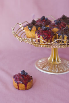 Cupcakes with chocolate and berries frosting