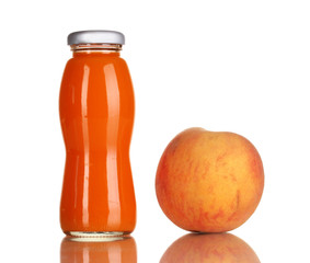 Delicious peach juice in glass bottle and peach next to it
