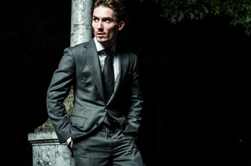 Fototapeta premium guy walking night after meeting business