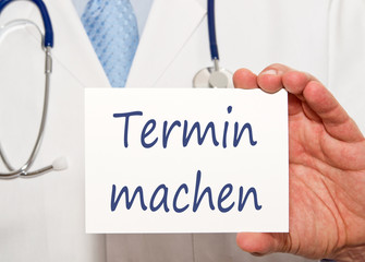 Termin machen - Arzt mit Schild