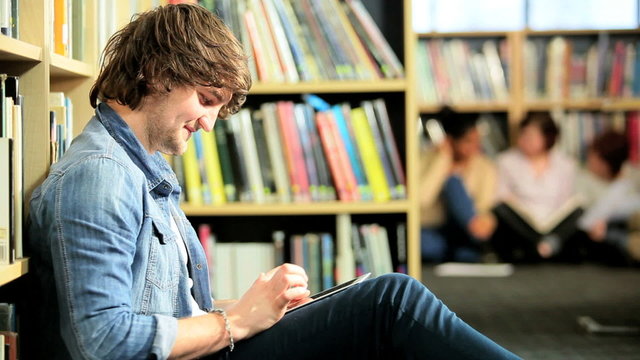 Male classmate networking online in college hub