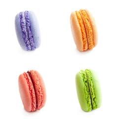 four delicious french macaron cookies  isolated on white