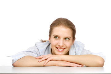 Obraz premium A young college girl sitting, her arms on thee table