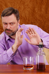 man refusing alcohol
