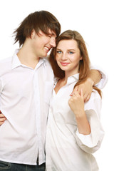 The man and the woman embrace. Isolated on the white background