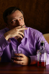 guy drinking and smoking