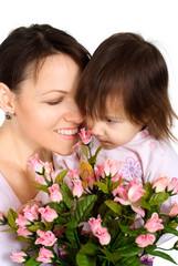 Nice Caucasian woman with a daughter and flowers