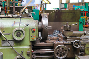 Old lathe in workshop of the plant