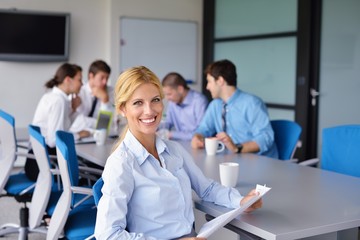 Fototapeta premium business woman with her staff in background at office