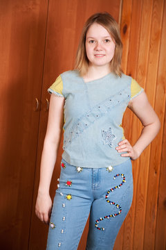 girl shows   cloth beaded by herself