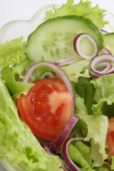 A green salad on a plate, closeup