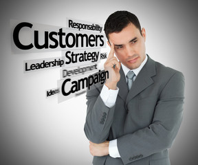 Businessman standing on the right side thinking grey background