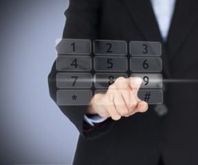 Business woman entering pin on digital number pad