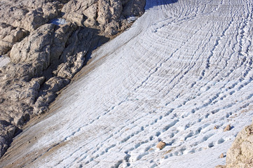 Glacier with cracks on the mountain slope