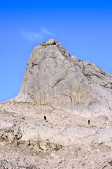 Two climbers in the mountains among the rocks
