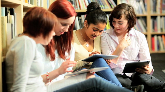 Diverse friends study online education in hub