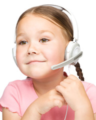 Cute little girl is talking to customers