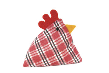 Chicken paper weight made of fabric on a white background.