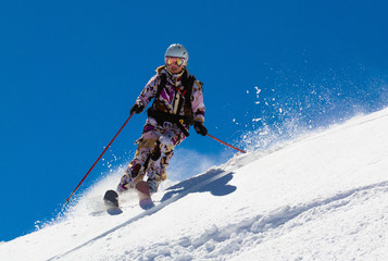 Woman skier in the deep snow