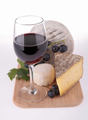 red wine and cheese on board