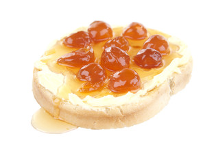 Slice of bread with butter and white cherry jam