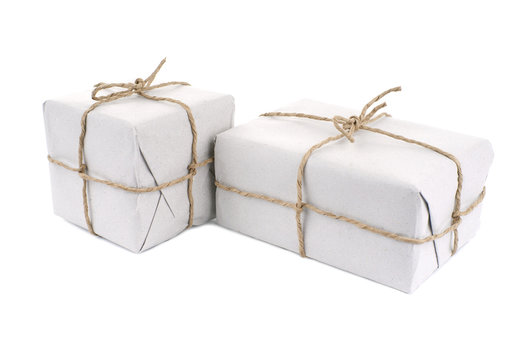Parcels wrapped with  paper, tied with string