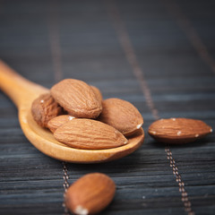 Almonds in a wooden spoon