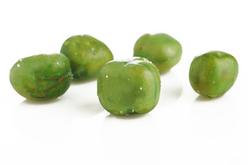 dried salted green peas on white background