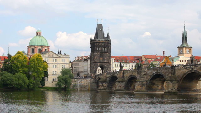 Prague, view of Karlov Bridge and tourists going on it