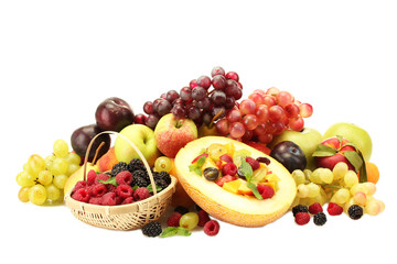 fresh fruits salad in melon, fruits and berries, isolated