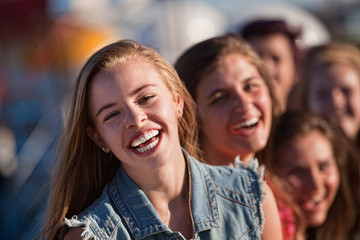 Young Blond Girl Laughing with Friends