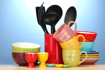 bright empty bowls, cups and kitchen utensils
