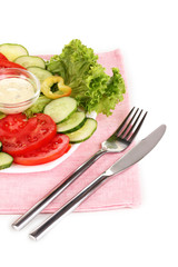 Chopped vegetables and sauce on plate isolated on white