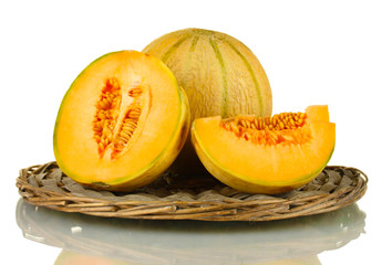 cut melon on wicker mat isolated on white