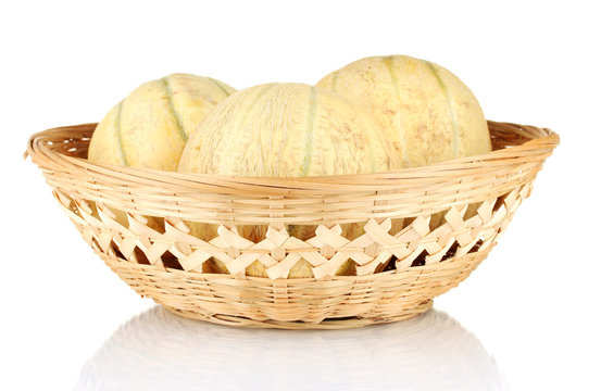 sweet melons in basket isolated on white
