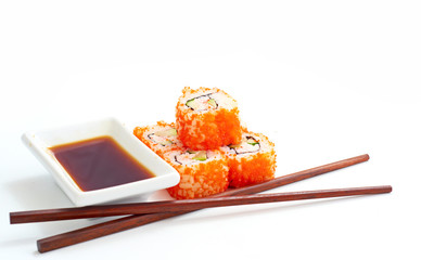 Sushi with chopsticks isolated over white background