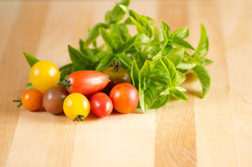 Tomatoes and basil on a cutting board