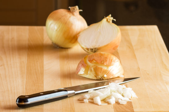 Sliced onions on cutting board