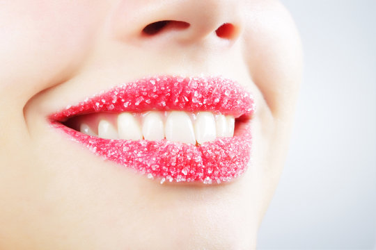 Woman's lips strewed with sugar