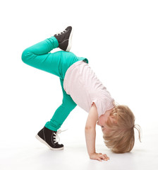 Active little girl doing sport exercises
