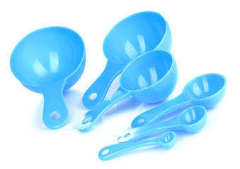 Blue measuring spoons isolated on white