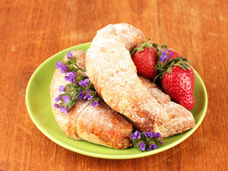 Fresh bagels with strawberry in the plate