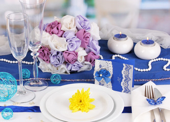Serving fabulous wedding table in purple and blue color of the