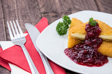 Portion of fried cheese with Cranberries