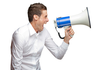 Portrait Of Young Man Shouting On Megaphone