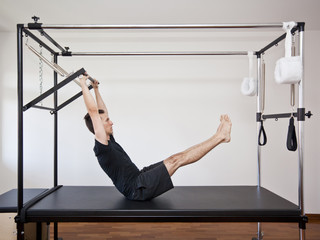 man practicing pilates
